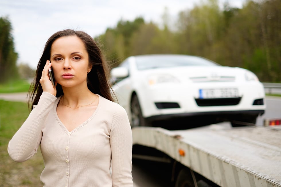 Woman Calling While Tow Truck